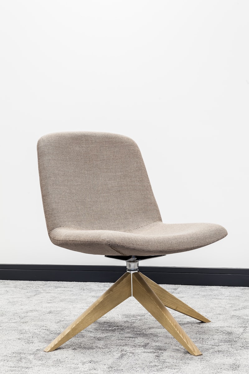 Ergonomic office chair with adjustable lumbar support at a modern desk setup