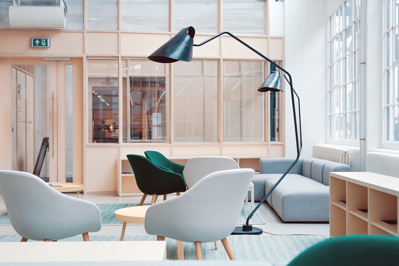 Side view of an ergonomic mesh office chair showing adjustable armrests and headrest