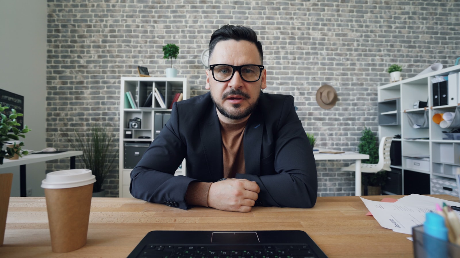 Person on a webcam video call at a laptop