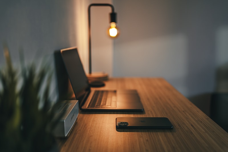 Clean ergonomic desk setup with monitor at eye level, external keyboard, and proper chair height